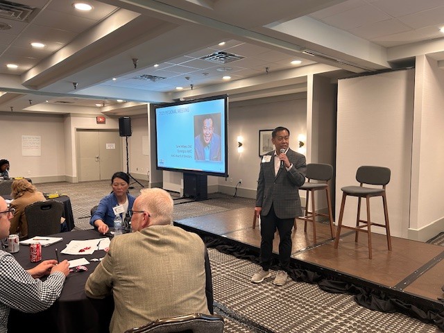 A speaker presenting at the 2025 Regional Meeting