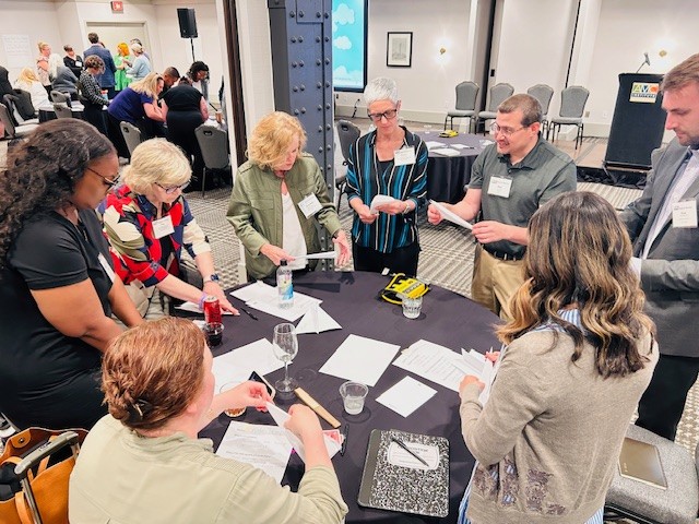 Attendees working together at a session table